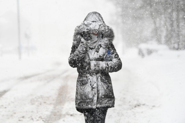 BALLOCH, UNITED KINGDOM - MARCH 01: A woman makes her way through the snow on March 1, 20