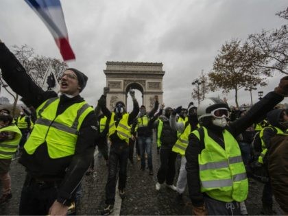 PARIS, FRANCE - DECEMBER 01: Protesters yell during a 'Yellow Vest' demonstration near the