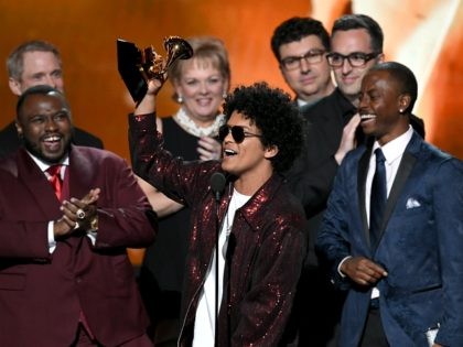NEW YORK, NY - JANUARY 28: Recording artist Bruno Mars (C) accepts Album of the Year for &