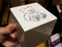Picture of cube urn containing the ashes of a deceased infant.