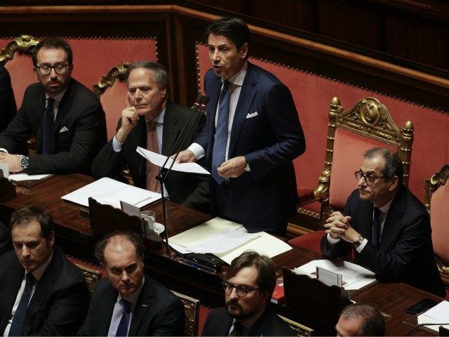 Italian Premier Giuseppe Conte delivers his speech on the budget law at the Senate, in Rome, Wednesday, Dec. 19, 2018. The European Commission says it has reached an agreement with Italy to avert legal action over the country's budget plans, which the EU's executive arm had warned could break euro …