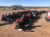 Large group of aliens sitting down after being apprehended near the US-Mexico border in Arizona Large group of aliens sitting down after being apprehended near the US-Mexico border in Arizona. (Photo: U.S. Border Patrol/Tucson Sector)
