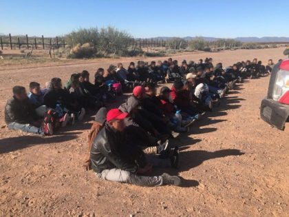 Large group of aliens sitting down after being apprehended near the US-Mexico border in Arizona. (Photo: U.S. Border Patrol/Tucson Sector)