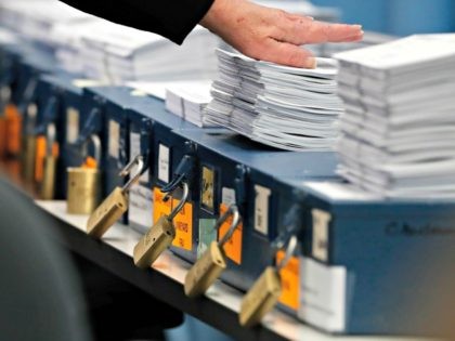 Ballots are prepared to be tabulated for Maine's Second Congressional District's House election Monday, Nov. 12, 2018, in Augusta, Maine. The election is the first congressional race in American history to be decided by the ranked-choice voting method that allows second choices.