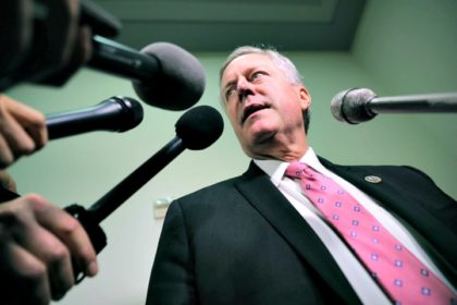 House Oversight and Government Reform Committee member Rep. Mark Meadows (R-NC) talks with reporters in the Rayburn House Office Building on Capitol Hill October 19, 2018 in Washington, DC. Meadows, who is the chairman of the House Freedom Caucus, has been leading the charge of misconduct against officials involved in …
