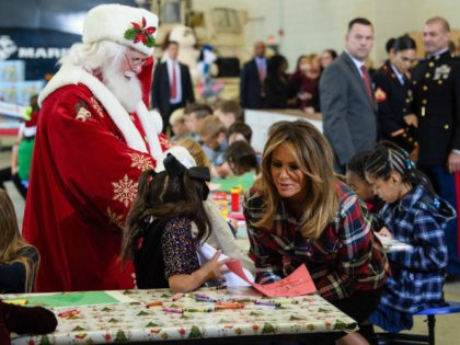 US First Lady Melania Trump attends with Father Christmas personificator a Toys for Tots event at Joint Base Anacostia-Bolling in Washington, DC, on December 11, 2018. - Toys for Tots is a program run by the United States Marine Corps Reserve which distributes toys to children whose parents cannot afford …
