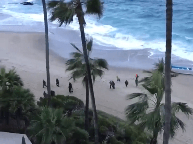 Migrants make U.S. landfall in a panga boat at Laguna Beach, CA. (Photo: Laguna Beach Police Department Video Screenshot)