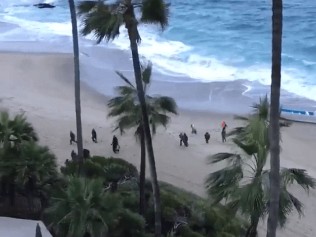 Migrants make U.S. landfall in a panga boat at Laguna Beach, CA. (Photo: Laguna Beach Poli