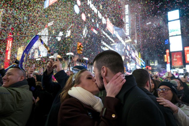 Kaitlin Olivi of Yonkers, N.Y., and Lucas Pereira, of Sayreville, N.J., kiss as confetti falls during a celebration of the new year in New York's Times Square, Sunday, Jan. 1, 2017.