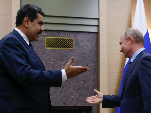 Russian President Vladimir Putin (R) meets with his Venezuelan counterpart Nicolas Maduro at the Novo-Ogaryovo state residence outside Moscow on December 5, 2018. (Photo by MAXIM SHEMETOV / POOL / AFP) (Photo credit should read MAXIM SHEMETOV/AFP/Getty Images)