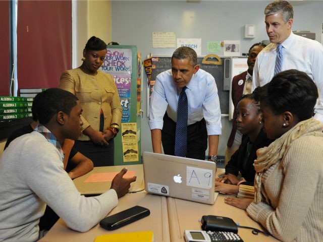 US President Barack Obama chats with students during a visit to a classroom at Pathways in