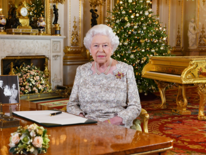 A picture released on December 24, 2018 shows Britain's Queen Elizabeth II posing for a photograph after she recorded her annual Christmas Day message, in the White Drawing Room of Buckingham Palace in central London. (Photo by John Stillwell / POOL / AFP) (Photo credit should read JOHN STILLWELL/AFP/Getty Images)