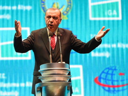 Turkey's President Recep Tayyip Erdogan speaks at the official opening ceremony of Istanbul's new airport (Istanbul Yeni Havalimani) on October 29, 2018 in Istanbul, Turkey. New mega-hubs first phase includes two runways, a terminal and is expected to have an annual passenger capacity of 90 million. Once all four phases …
