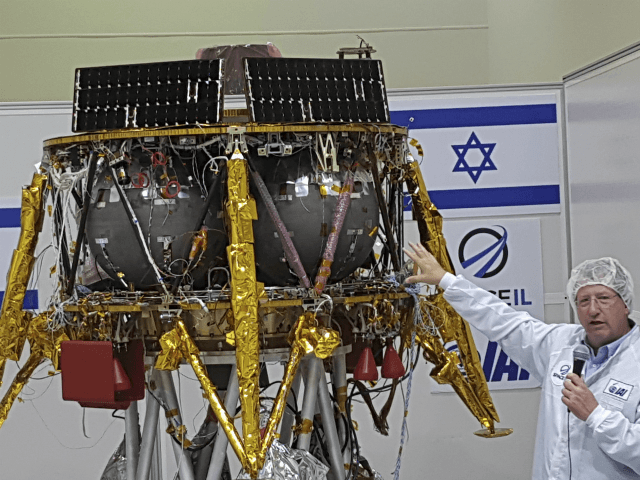 Opher Doron, general manager of Israel Aerospace Industries' space division, speaks beside the SpaceIL lunar module, in a special "clean room" where the space craft is being developed, during a press tour of their facility near Tel Aviv, Israel, Tuesday, July 10, 2018. SpaceIL and the state-owned Israel Aerospace Industries …