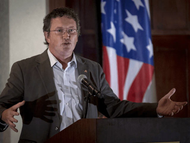 U.S. Rep. Thomas Massie, R-Ky, speaks to supporters gathered at The Champions of Liberty Rally in Hebron, Ky., Friday, Aug. 11, 2017. (AP Photo/Bryan Woolston)