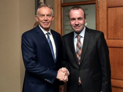 WICKLOW, IRELAND - MAY 12: Former British Prime Minister Tony Blair (L) is greeted by EPP