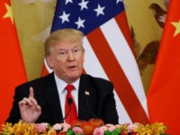 Trump-finger up-US-China-flags-background-getty U.S. President Donald Trump and China's President Xi Jinping (not shown) make a joint statement at the Great Hall of the People on November 9, 2017 in Beijing, China. Trump is on a 10-day trip to Asia. (Photo by Thomas Peter-Pool/Getty Images)