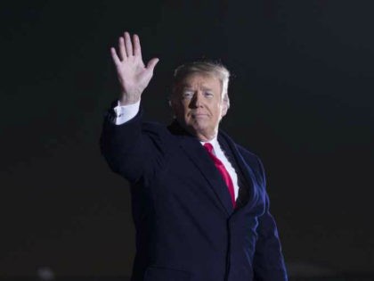 President Donald Trump waves after speaking during a rally for Sen. Cindy Hyde-Smith, R-Miss., at Tupelo Regional Airport, Monday, Nov. 26, 2018, in Tupelo, Miss. (AP Photo/Alex Brandon)