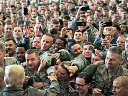 US President Donald Trump (bottom L-back to camera) greets US troops after speaking during an event with US military personnel at Yokota Air Base at Fussa in Tokyo on November 5, 2017. Trump touched down in Japan on November 5, kicking off the first leg of a high-stakes Asia tour …
