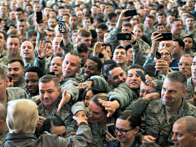 US President Donald Trump (bottom L-back to camera) greets US troops after speaking during an event with US military personnel at Yokota Air Base at Fussa in Tokyo on November 5, 2017. Trump touched down in Japan on November 5, kicking off the first leg of a high-stakes Asia tour …