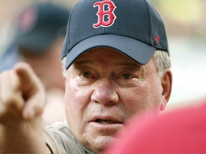 William Shatner gestures on the field at Fenway Park before throwing out the ceremonial first pitch at a baseball game between the Boston Red Sox and the Arizona Diamondbacks in Boston, Friday, Aug. 12, 2016. (AP Photo/Michael Dwyer)