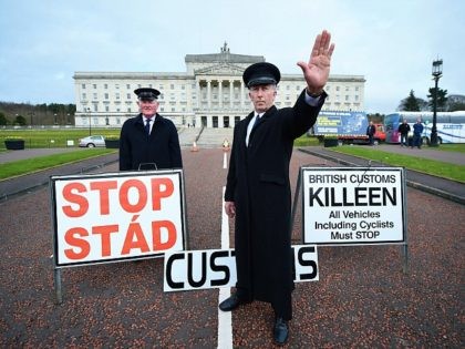 BELFAST, NORTHERN IRELAND - MARCH 29: Two men dressed as customs officers take part in a protest outside Stormont against Brexit and its possible effect on the north and south Irish border on March 29, 2017 in Belfast, Northern Ireland. British Prime Minister Theresa May will address the Houses of …