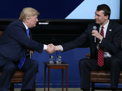 WASHINGTON, DC - MARCH 22: U.S. President Donald Trump shakes hands with conservative activist Charlie Kirk at a forum dubbed the Generation Next Summit at the White House on March 22, 2018 in Washington, DC. The meeting brought together young Americans with members of the Trump administration to discuss the …