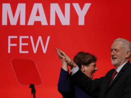 BRIGHTON, ENGLAND - SEPTEMBER 25: Labour Leader Jeremy Corbyn High Fives Shadow First Secretary of State Emily Thornberry after her key note speach in the main hall during day two of the Labour Party Conference on September 25, 2017 in Brighton, England. (Photo by Dan Kitwood/Getty Images)