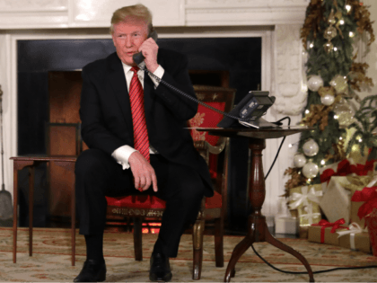U.S. President Donald Trump and first lady Melania Trump as they track Santa Claus's movements with the North American Aerospace Defense Command (NORAD) Santa Tracker on Christmas Eve at the White House December 24, 2018 in Washington, DC. This is the 63rd straight year that NORAD has publicly tracked Santa’s …