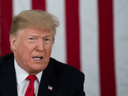 US President Donald Trump speaks at a military briefing during an unannounced trip to Al A