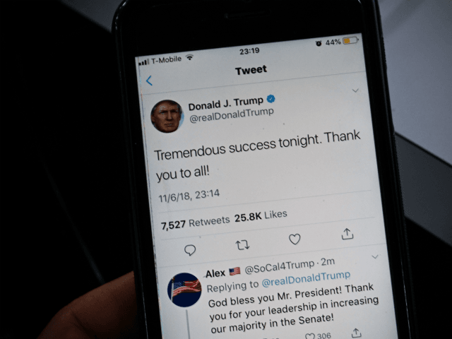 A smartphone shows a tweet by US President Donald Trump saying 'Tremendous success tonight' after most of the result of the US midterm elections were called by US Media on November 06, 2018 in Washington, DC. - President Donald Trump called Tuesday's midterm congressional elections a 'tremendous success,' despite his …