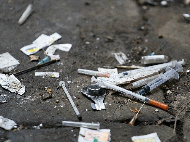 WALSALL, ENGLAND - DECEMBER 06: Syringes and paraphernalia used by drug users litter an alley way in Walsall Town Centre on December 06, 2018 in Walsall, England. There were 268,390 adults in contact with drug and alcohol services in 2017 to 2018, according to a recent government report, which is …