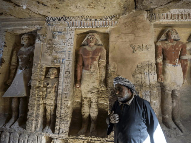 Said Abdel Aal, an Egyptian archaelogical labourer, stands in a newly-discovered tomb at t