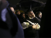People attend the funeral of a baby who died after being prematurely delivered after her mother Shira Ish-Ran was wounded in a shooting attack near Ofra settlement in the West Bank last Sunday, in Jerusalem, Wednesday, Dec. 12, 2018. (AP Photo/Heidi Levine)