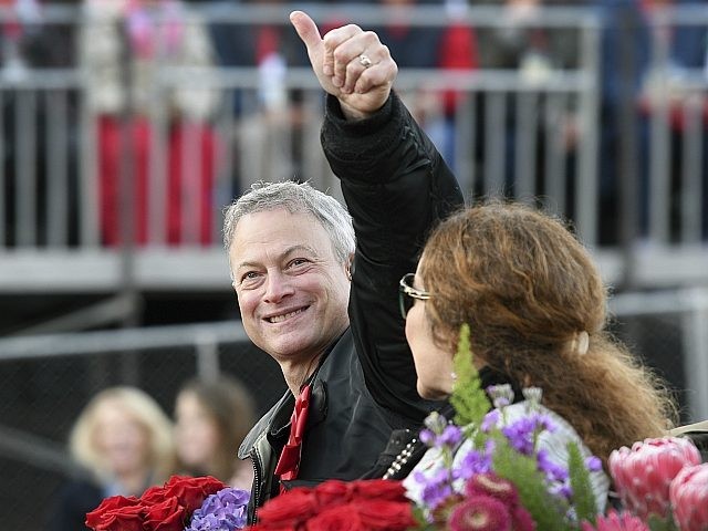 Grand Marshal Gary Sinise gives a thumbs up to the crowd at the 129th Rose Parade in Pasad