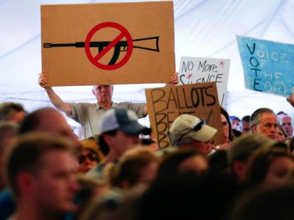 A man displays an anti gun violence sign during a March for our Lives Rally at Fairfield H