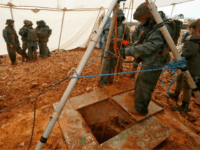 hezbollah tunnels A picture taken on December 19, 2018 during a guided tour by the Israeli army shows an Israeli soldier operating a pulley while standing outside an entry point made by the army to intercept a tunnel which reportedly connects between Lebanon and Israel, near the border near the northern Israeli …