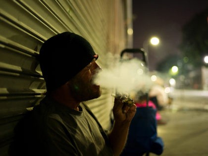 D. J. Meek, a 40-year-old homeless drug addict, smokes crystal meth Friday, Sept. 8, 2017, in the Skid Row area of downtown Los Angeles. Meeks' veins are collapsed due to chronic use of heroin. He said talking to himself makes him unemployable. The latest nationwide homeless count shows that 4 …