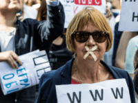 internet A protester with tape covering her mouth takes part in the March for Free Internet in central Moscow on July 23, 2017. / AFP PHOTO / Mladen ANTONOV (Photo credit should read MLADEN ANTONOV/AFP/Getty Images)