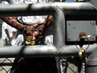 jail prisoner handcuffs A condemned inmate stands with handcuffs on as he preapres to be released from the exercise yard back to his cell at San Quentin State Prison's death row on August 15, 2016 in San Quentin, California. San Quentin State Prison opened in 1852 and is California's oldest penitentiary. The facility …