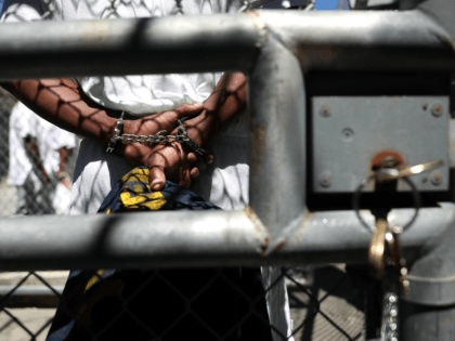 A condemned inmate stands with handcuffs on as he preapres to be released from the exercise yard back to his cell at San Quentin State Prison's death row on August 15, 2016 in San Quentin, California. San Quentin State Prison opened in 1852 and is California's oldest penitentiary. The facility …