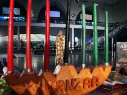 Camille Yarborough sings African music behind a traditional 'kinara' candelabra during a news preview of the 'Kwanzaa 2004: We Are Family' festival at the American Museum of Natural History December 22, 2004 in New York City. The festival will take place December 26 and will include traditional African dance, spoken …