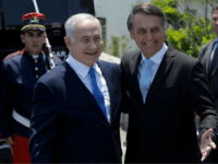 Israel's Prime Minister Benjamin Netanyahu (L) is welcomed by Brazil's President-elect Jair Bolsonaro at the Copacabana fort in Rio de Janeiro, Brazil, on December 28, 2018. - Netanyahu hailed what he said would be a 'new era' in ties with 'great power' Brazil ahead of a meeting with the Latin …