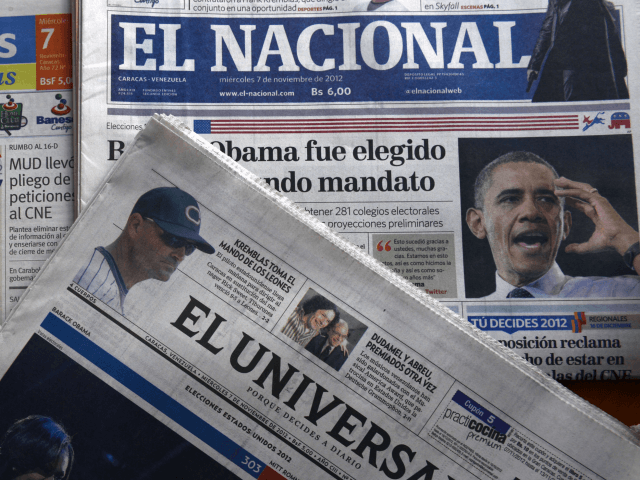 Newspapers headline US President Barack Obama's reelection on November 7, 2012 in Caracas. AFP PHOTO/JUAN BARRETO (Photo credit should read JUAN BARRETO/AFP/Getty Images)
