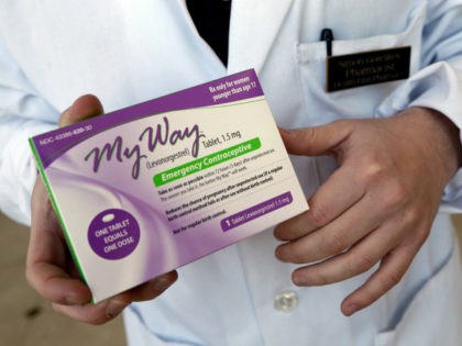 In this May 2, 2013, file photo, pharmacist Simon Gorelikov holds a generic emergency contraceptive at the Health First Pharmacy in Boston. More than 1 in 5 sexually active teen girls have used the morning-after pill — a dramatic increase that likely reflects that it's easier now for teens to …