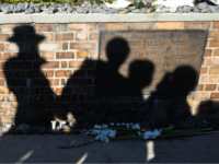 plaques jewish Shadow are cast on a memorial plaque at platform 17, during a ceremony to commemorate Jewish citizens deported during WWII in Berlin, Thursday, Oct. 18, 2012. October 18, 1941 marks the start of the systematic deportation of Berlin's Jewish people. (AP Photo/Markus Schreiber)