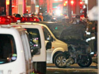 Police inspect a car whose driver rammed his vehicle into crowds on Takeshita street in Tokyo early January 1, 2019. - Nine people were hurt, one seriously, when a man deliberately ploughed his car into crowds celebrating New Year's Eve along a famous Tokyo street, police and media said on …