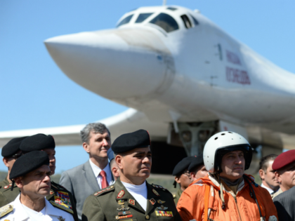 Venezuelan Defence Minister Vladimir Padrino (2-L) is pictured after the arrival of two Russian Tupolev Tu-160 strategic long-range heavy supersonic bomber aircrafts at Maiquetia International Airport, just north of Caracas, on December 10, 2018. - Venezuela and Russia will hold joint air force exercises for the defence of the South …