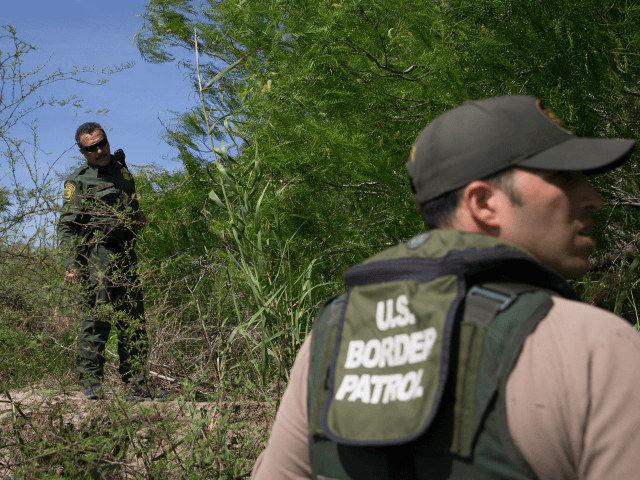 Border Patrol agents search the Rio Grande River for illegal immigrants crossing the borde