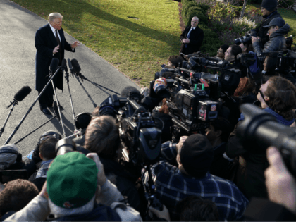 U.S. President Donald Trump speaks to members of the media prior to his departure from the
